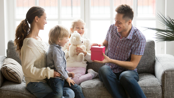 Receiving present on fathers day concept, family kids congratula